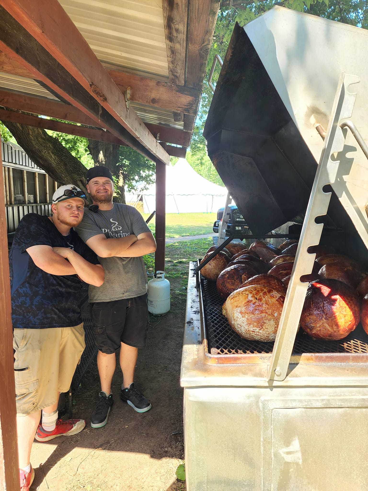 KP Katering team members grilling at an outdoor event